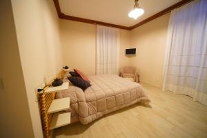 Postel nebo postele na pokoji v ubytování CASA VACANZE DA DANIELE + 4 fotografie