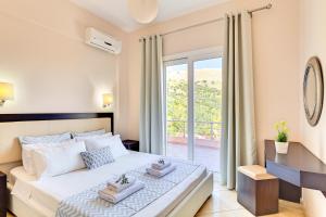 Postel nebo postele na pokoji v ubytování Oceana Suites