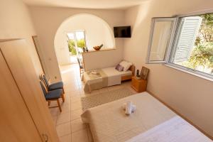 Postel nebo postele na pokoji v ubytování Apartmani Maja