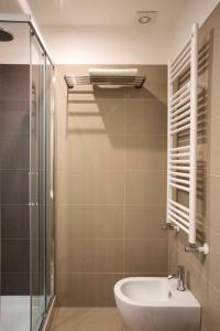 a bathroom with a sink and a glass shower at Four Elements in Rome