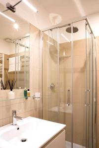 a bathroom with a shower and a sink at Four Elements in Rome