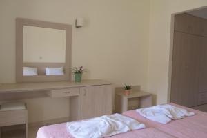 Postel nebo postele na pokoji v ubytování Alkyon Beach Hotel