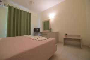 Postel nebo postele na pokoji v ubytování Alkyon Beach Hotel