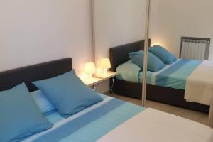 A bed or beds in a room at BLURAPALLO