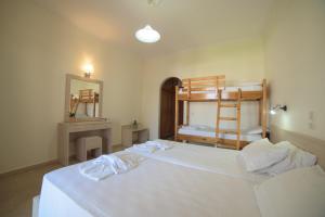 Postel nebo postele na pokoji v ubytování Alkyon Beach Hotel