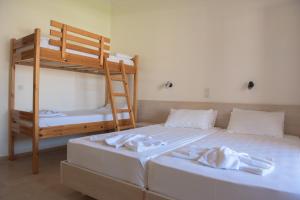 Postel nebo postele na pokoji v ubytování Alkyon Beach Hotel