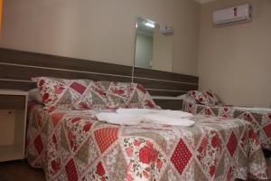 Cama o camas de una habitación en Pousada Monte Bello Canela