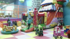 a childrens play area with toy cars and a slide at Pleasure Apartment near center of Odessa in Odesa