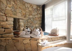a stone room with towels on a window ledge at Lethe Exclusive Hotel in Ağva