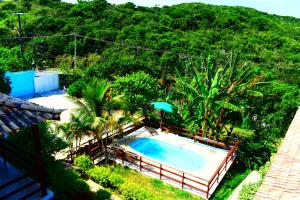 an overhead view of a swimming pool with trees at pousada CASA 29 BÚZIOS in Búzios