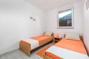 Posteľ alebo postele v izbe v ubytovaní Modra Kuca