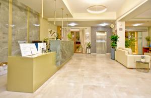 a lobby of a hospital with a reception desk at Georgia's Garden by Omilos Hotels in Amoudara Herakliou
