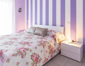 Postel nebo postele na pokoji v ubytování Il Sopracciglio Suites - Pink Apartment