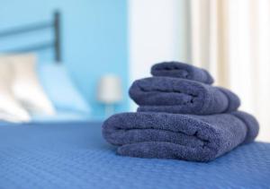 A bed or beds in a room at Il Sopracciglio Suites - Red Suite
