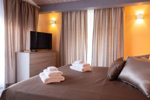 A bed or beds in a room at Il Sopracciglio Suites - Red Suite