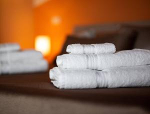 A bed or beds in a room at Il Sopracciglio Suites - Red Suite