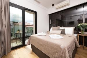 Posteľ alebo postele v izbe v ubytovaní Tsikeli Boutique Hotel Meteora - Adults Friendly