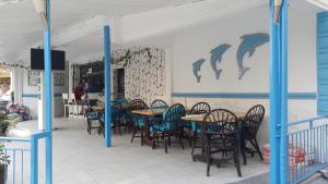 מסעדה או מקום אחר לאכול בו ב-Delphin Hotel Side