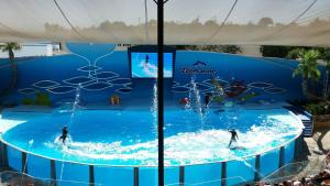 two people in a wave pool at a water park at Beach Falésia in Albufeira