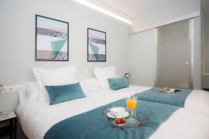 Postel nebo postele na pokoji v ubytování Palacios Rooms