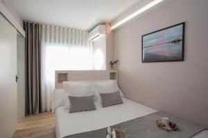 Postel nebo postele na pokoji v ubytování Palacios Rooms