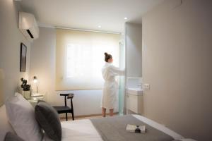 Postel nebo postele na pokoji v ubytování Palacios Rooms