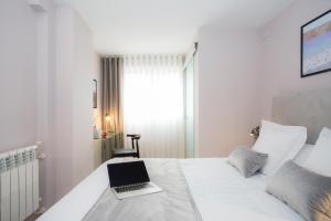 Postel nebo postele na pokoji v ubytování Palacios Rooms