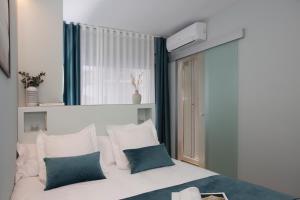 Postel nebo postele na pokoji v ubytování Palacios Rooms