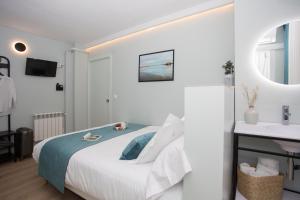 Postel nebo postele na pokoji v ubytování Palacios Rooms