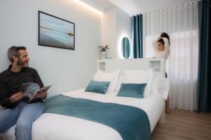 Postel nebo postele na pokoji v ubytování Palacios Rooms