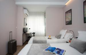 Postel nebo postele na pokoji v ubytování Palacios Rooms