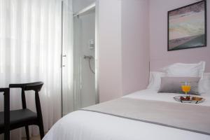 Postel nebo postele na pokoji v ubytování Palacios Rooms