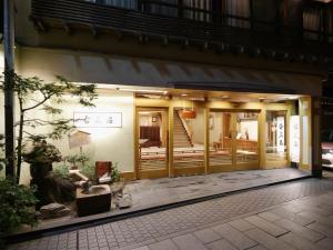 an entrance to a building with a staircase in it at Shibu Onsen KOKUYA in Yamanouchi