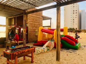 a playground with a play equipment in the sand at Ensueños en Laguna Del Mar in La Serena