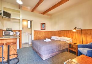 Postel nebo postele na pokoji v ubytování New Central Hotel Woodville