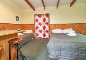 Postel nebo postele na pokoji v ubytování New Central Hotel Woodville