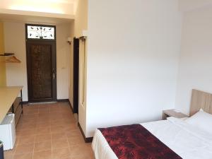 Moon Shine B&B tesisinde bir odada yatak veya yataklar