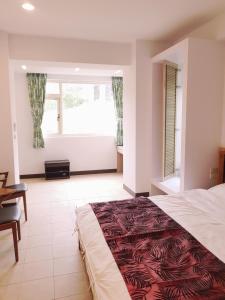 Moon Shine B&B tesisinde bir odada yatak veya yataklar