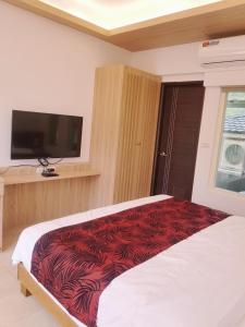 Moon Shine B&B tesisinde bir odada yatak veya yataklar