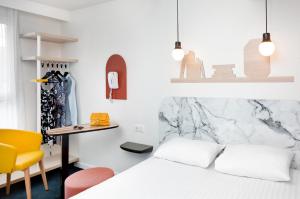 Katil atau katil-katil dalam bilik di Hôtel ibis Styles Vichy Centre