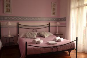 Säng eller sängar i ett rum på B&B Tosca