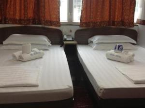 Postelja oz. postelje v sobi nastanitve Traveller's Hostel