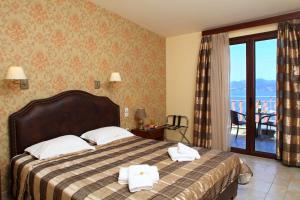 Postel nebo postele na pokoji v ubytování Hotel Tesoro