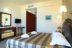 Postel nebo postele na pokoji v ubytování Hotel Tesoro