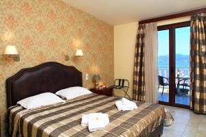 Postel nebo postele na pokoji v ubytování Hotel Tesoro