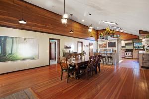 a dining room and kitchen with a table and chairs at Fort Bragg Farmhouse in Fort Bragg