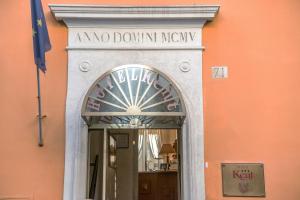 an no doolin treaty sign over a doorway in a building at Hotel Kent in Rome