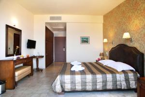 Postel nebo postele na pokoji v ubytování Hotel Tesoro