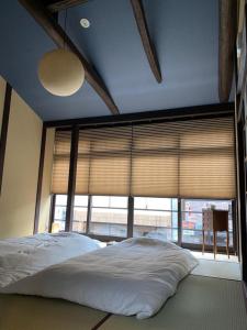 Säng eller sängar i ett rum på Chizuruan