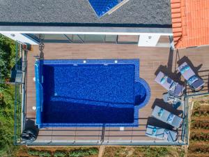 an overhead view of a swimming pool on a deck at Casa Lira in Arco da Calheta